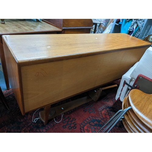 171 - A mid 20th century Younger teak sideboard having two cupboard doors and four drawers 79cm h x 167.5c... 