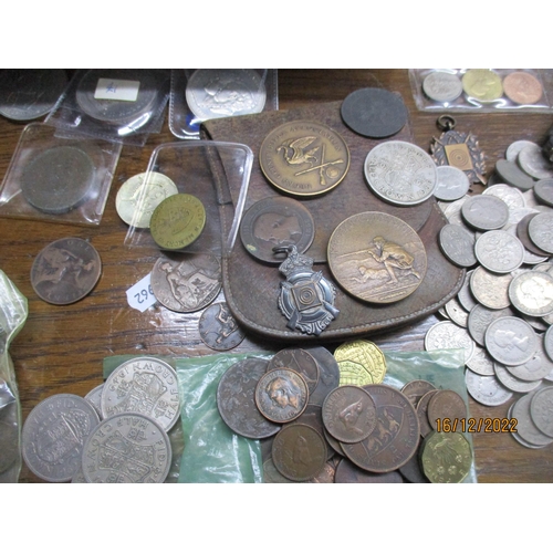 205 - A cash tin containing various British coinage and medals to include a copper George III halfpenny, s... 