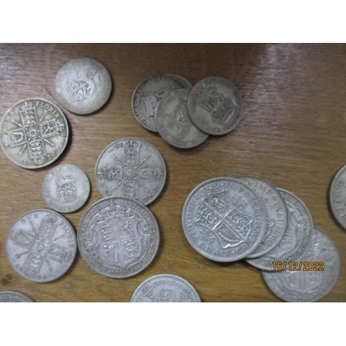 206 - A quantity of British pre-1948 silver coinage to include half-Crowns, two-shilling, florins, shillin... 