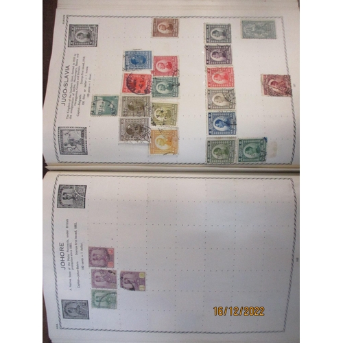 215 - An early 20th century Triumph Stamp album containing mounted world stamps including China, Straits S... 