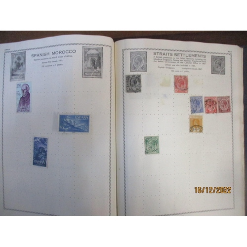 215 - An early 20th century Triumph Stamp album containing mounted world stamps including China, Straits S... 