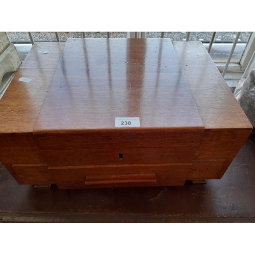 238 - A mid 20th century canteen of Walker and Hall plated cutlery, the case having two sections
Location:... 