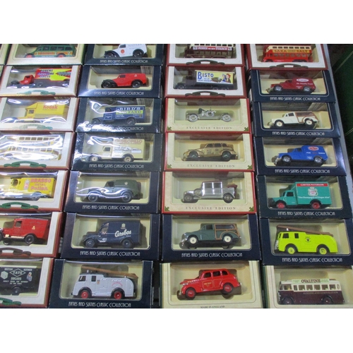 242 - A collection of boxed Days Gone toy cars, busses and lorries to include Smith's potato crisps, Bisto... 