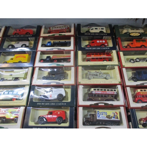 242 - A collection of boxed Days Gone toy cars, busses and lorries to include Smith's potato crisps, Bisto... 