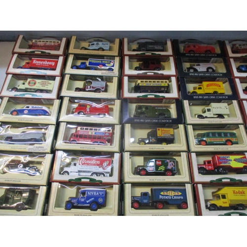 242 - A collection of boxed Days Gone toy cars, busses and lorries to include Smith's potato crisps, Bisto... 