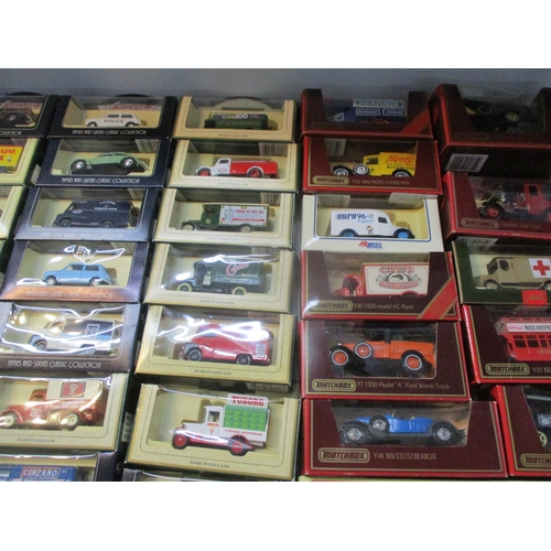 243 - A collection of boxed Days Gone vintage models, matchbox cars, buses and vans to include Kodak, Bosc... 