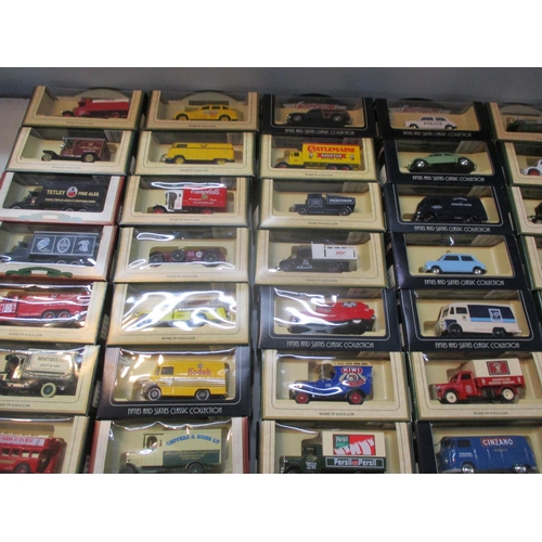 243 - A collection of boxed Days Gone vintage models, matchbox cars, buses and vans to include Kodak, Bosc... 