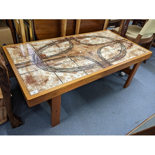 249 - A vintage teak and tile topped rectangular coffee table on block shaped legs 44cm h x 127cm w Locati... 