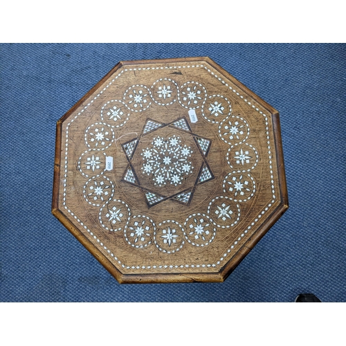 291 - A late 19th/early 20th century occasional table of octagonal form inlaid with bone and mother of pea... 