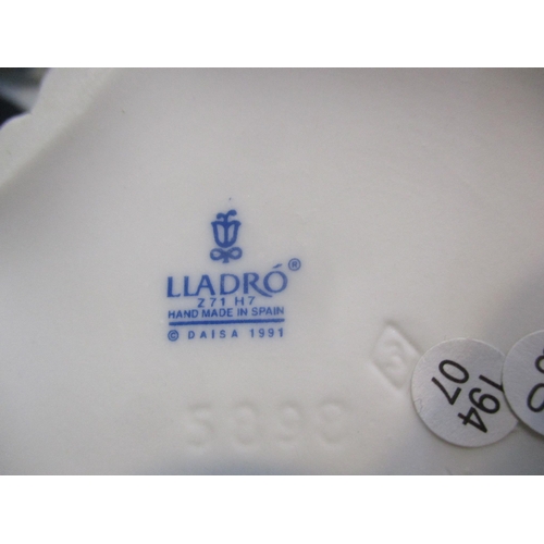 318 - A collection of Lladro and Nao to include Lladro Harlequin Reclining, Lladro figurine Spring Splendo... 