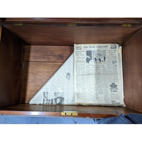 55 - An early 19th century camphor wood campaign style dower chest having a hinged top with drawer below ... 