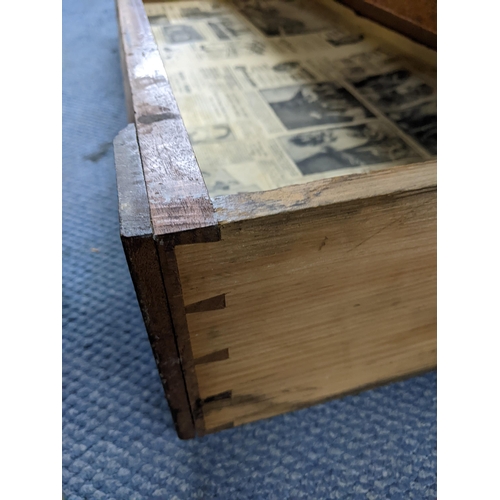 55 - An early 19th century camphor wood campaign style dower chest having a hinged top with drawer below ... 