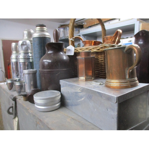 92 - A mixed lot of copper and brassware to include hand bells, various thermos flasks, a leather holder ... 