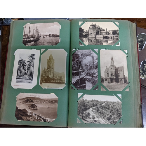 221 - An album of approximately four hundred postcards to include historical buildings, greeting cards Alb... 