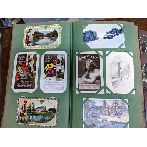 221 - An album of approximately four hundred postcards to include historical buildings, greeting cards Alb... 