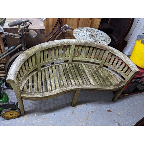 460 - A late 20th century teak curved back garden bench with serpentine front seat
Location:G