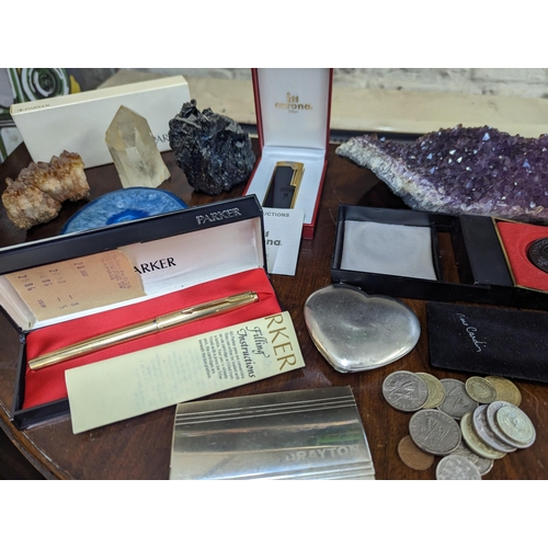 173 - A mixed lot to include a boxed Parker fountain pen having a 14k nib, a Royal lighter, crystals, coin... 