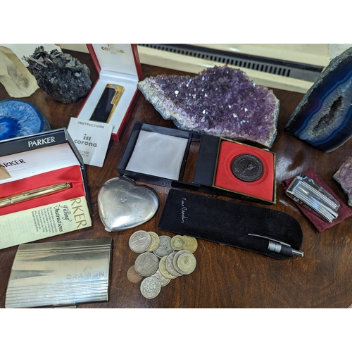 173 - A mixed lot to include a boxed Parker fountain pen having a 14k nib, a Royal lighter, crystals, coin... 