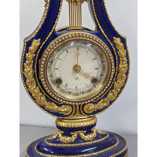 180 - A replica Marie-Antoinette clock from the Victoria & Albert Museum, in a blue porcelain case with gi... 