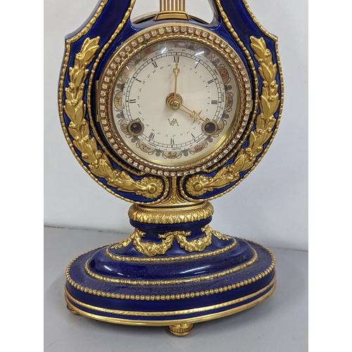 180 - A replica Marie-Antoinette clock from the Victoria & Albert Museum, in a blue porcelain case with gi... 