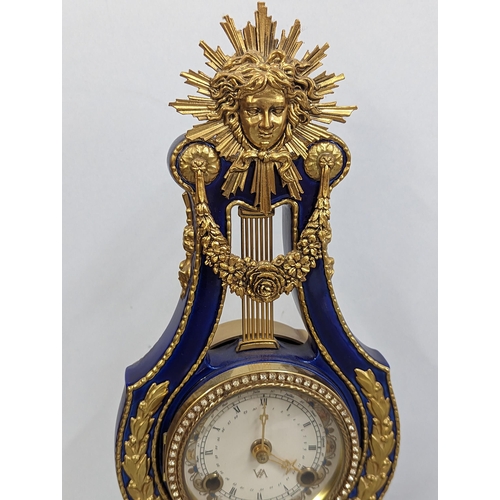 180 - A replica Marie-Antoinette clock from the Victoria & Albert Museum, in a blue porcelain case with gi... 