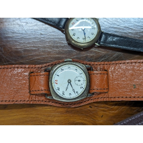 261 - A group of three silver cased wristwatches to include a trench watch example Location:CAB3