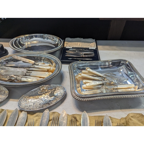 38 - A mixed lot of silver plate to include lidded dishes, flatware to include silver collared examples, ... 