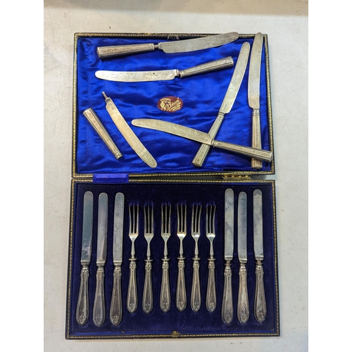 40 - A cased set of silver handled knives and forks, comprising of six knives and six forks, along with s... 