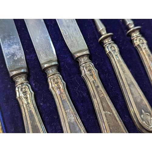 40 - A cased set of silver handled knives and forks, comprising of six knives and six forks, along with s... 