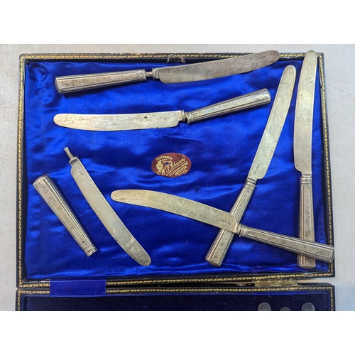 40 - A cased set of silver handled knives and forks, comprising of six knives and six forks, along with s... 