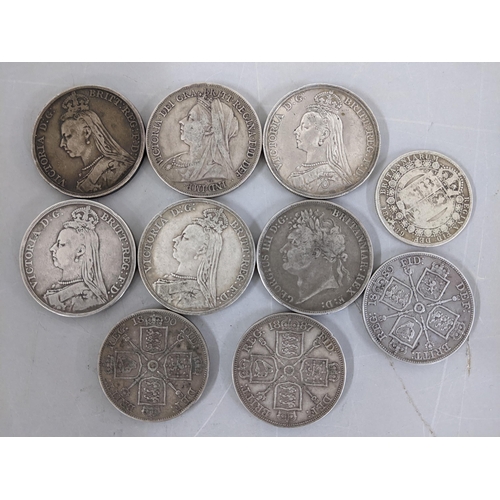 204 - A group of Victorian silver Crowns to include 1899 LXIII, and double florins, along with an 1889 hal... 