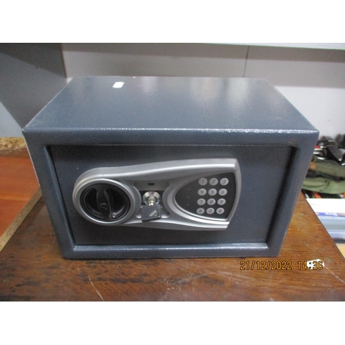 520 - A security safe with key, 31cm x 20cm
Location:G