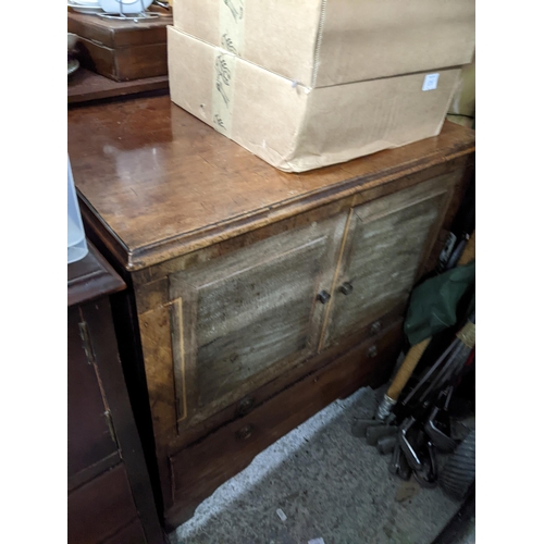 82 - A Georgian mahogany bedroom chest, two cupboard doors above two drawers, on bracket feet 70.5cm x 63... 