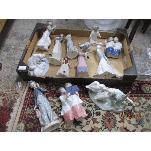 112 - A group of Lladro and Nao porcelain figurines and animal groups to include a Nao figure of two choir... 