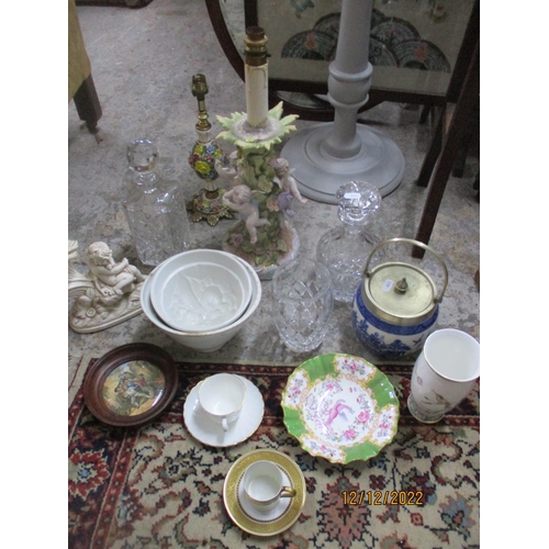 113 - A miscellaneous lot of ceramics and glassware to include a Sitzendorf table lamp, cut glass decanter... 