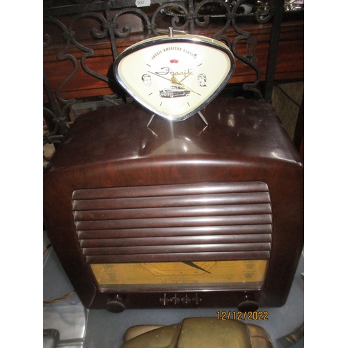 123 - A General Electric Company (GEC) Bakelite cased radio, a Fossil American classic alarm clock, metal ... 