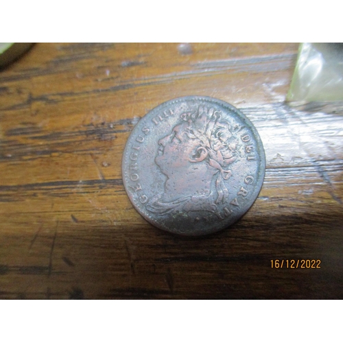 205 - A cash tin containing various British coinage and medals to include a copper George III halfpenny, s... 