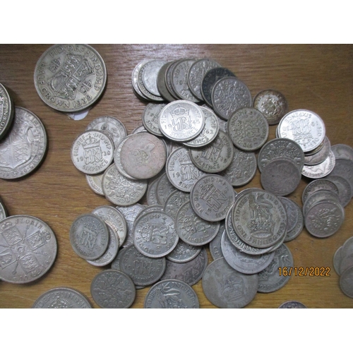 206 - A quantity of British pre-1948 silver coinage to include half-Crowns, two-shilling, florins, shillin... 