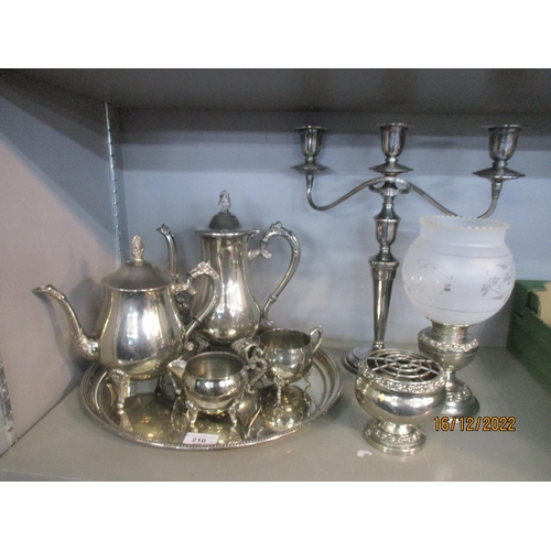 210 - A mixed lot of silver plate to include a Swatkins candelabra, and a four-piece tea set on tray Locat... 