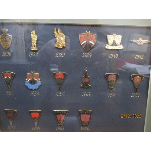 212 - Framed and glazed collection of miniature Rover car badges and a boxed tie pin Location:R2.3