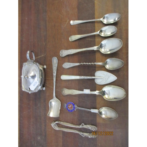 214 - A group of silver spoons another items to include a white metal filigree sugar tongs, heart shaped j... 