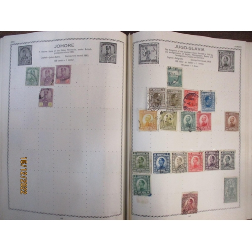 215 - An early 20th century Triumph Stamp album containing mounted world stamps including China, Straits S... 