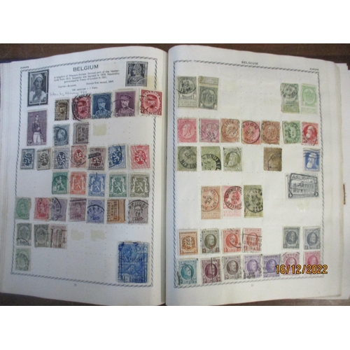 215 - An early 20th century Triumph Stamp album containing mounted world stamps including China, Straits S... 