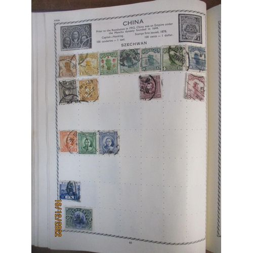 215 - An early 20th century Triumph Stamp album containing mounted world stamps including China, Straits S... 