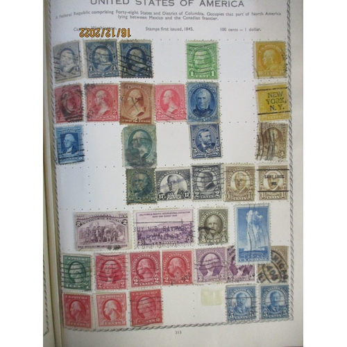 215 - An early 20th century Triumph Stamp album containing mounted world stamps including China, Straits S... 