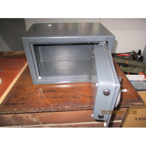 520 - A security safe with key, 31cm x 20cm
Location:G