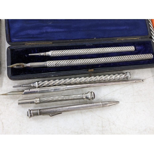 521 - Mixed pens and pencils to include a boxed S Mordan & Co set, silver pencil with spiral body and hard... 