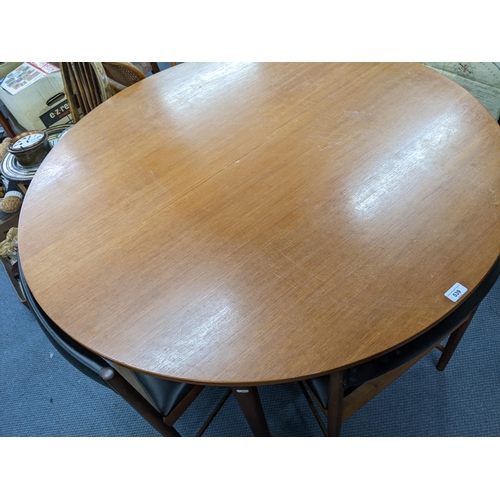 539 - A mid 20th century McIntosh teak circular extending dining table with six matching chairs
Location: ... 