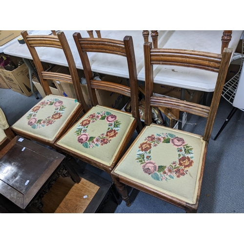 540 - A set of six late Victorian bar back dining chairs having tapestry upholstered seats and turned legs... 