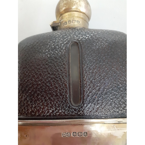 552 - A leather and silver cased hip flask
Location: TABLE